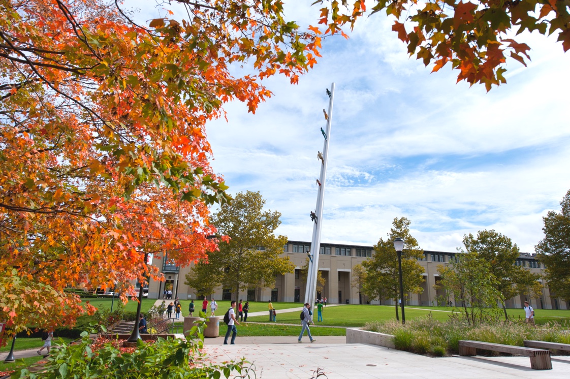 Students walking on campus in Autumn